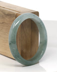 Baikalla Icy Oil-Green Jadeite Jade Oval Bangle (57.5mm)