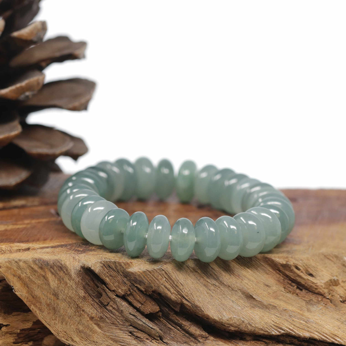 Baikalla Natural Icy Oil-Green Jadeite Jade Donut Shaped Bead Bracelet (12mm)