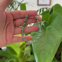Baikalla Genuine Green Jadeite Jade Round Beads Bracelet With 18K Yellow Gold Clasp and Gold Beads ( 7 mm )